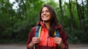 Young,Woman,Hiking,In,The,Forest,And,Enjoying